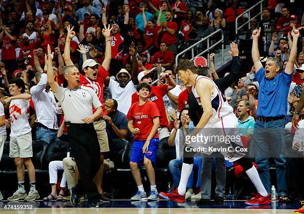 Fans react after Kyle Korver of the Atlanta Hawks hit a three pointer in the second half against the Cleveland Cavaliers during Game One of the...