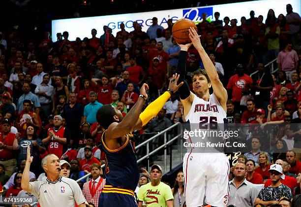 Kyle Korver of the Atlanta Hawks shoots a three pointer over Kyrie Irving of the Cleveland Cavaliers in the second half during Game One of the...