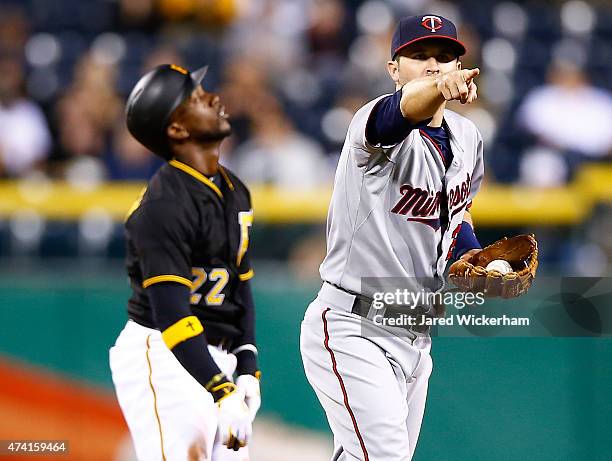 Brian Dozier of the Minnesota Twins reacts following batter interference on an attempted steal by Andrew McCutchen of the Pittsburgh Pirates in the...