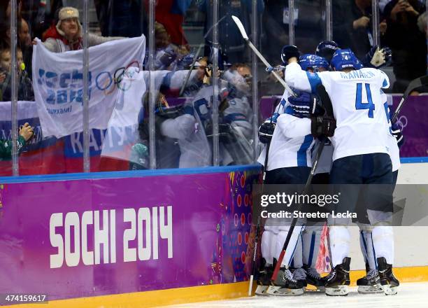 Teemu Selanne of Finland celebrates his goal with Ossi Vaananen against the United States in the second period during the Men's Ice Hockey Bronze...