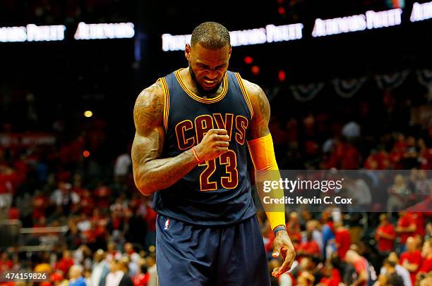 LeBron James of the Cleveland Cavaliers reacts in the final minutes of their 97 to 89 win over the Atlanta Hawks during Game One of the Eastern...