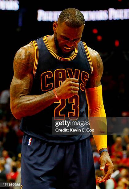 LeBron James of the Cleveland Cavaliers reacts in the final minutes of their 97 to 89 win over the Atlanta Hawks during Game One of the Eastern...