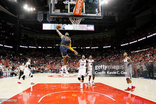 LeBron James of the Cleveland Cavaliers dunks against the Atlanta Hawks in the second half during Game One of the Eastern Conference Finals of the...