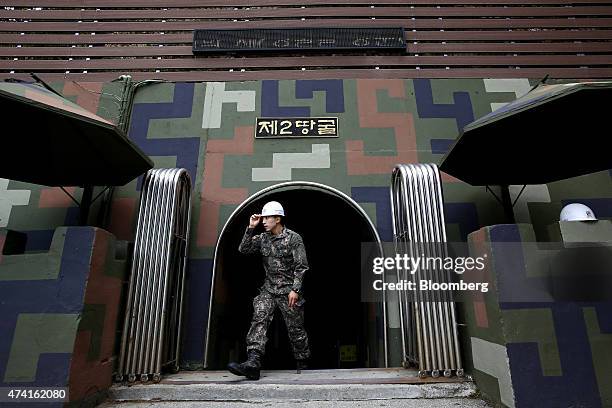 South Korean soldier exits the Second Tunnel, an "infiltration" tunnel dug by North Korea, near the demilitarized zone in Cheorwon, South Korea, on...