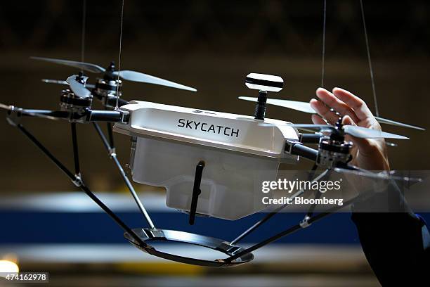 The Skycatch Inc. Unmanned aerial vehicle hangs on display at the International Drone Expo in Chiba, Japan, on Wednesday, May 20, 2015. The...