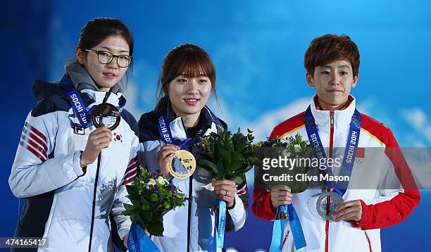 Bronze medalist Suk Hee Shim of South Korea, gold medalist Seung-Hi Park of South Korea and silver medalist Kexin Fan of China celebrate during the...