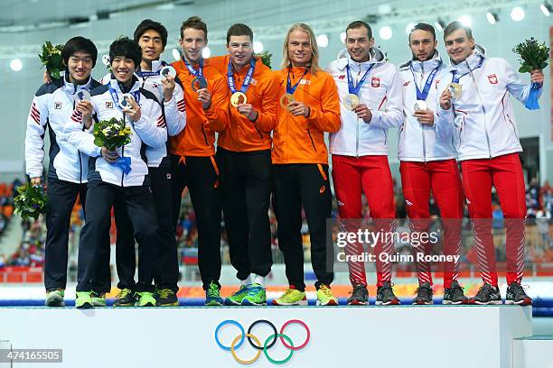 Silver medalists South Korea, gold medalists Netherlands and bronze medalists Poland celebrate on the podium during the medal ceremony for the Speed...