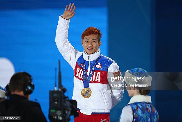 Gold medalist Victor An of Russia celebrates on the podium during the medal ceremony for the Short Track Men's 500m on Day 15 of the Sochi 2014...