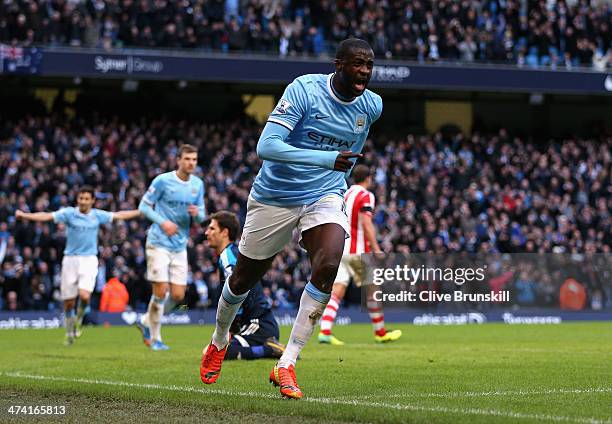 Yaya Toure of Manchester City celebrates scoring the opening goal during the Barclays Premier League match between Manchester City and Stoke City at...