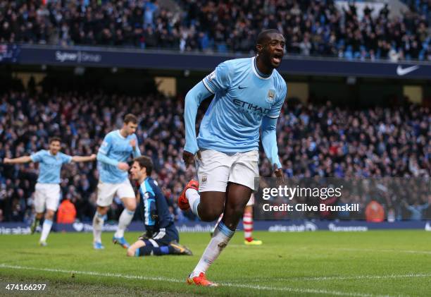 Yaya Toure of Manchester City celebrates scoring the opening goal during the Barclays Premier League match between Manchester City and Stoke City at...