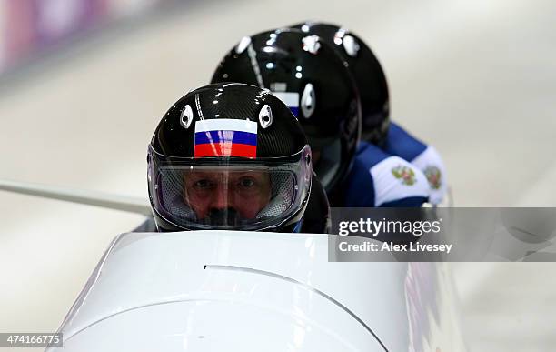 Pilot Alexander Zubkov, Alexey Negodaylo, Dmitry Trunenkov and Alexey Voevoda of Russia team 1 make a run during the Men's Four Man Bobsleigh heats...