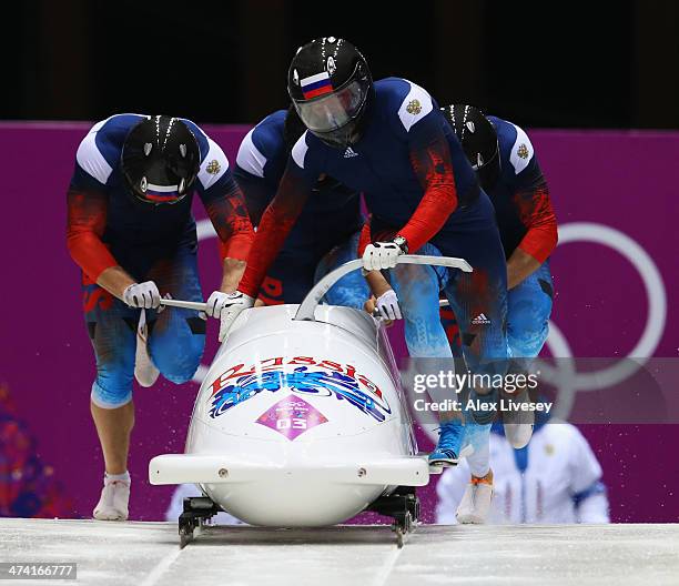 Pilot Alexander Zubkov, Alexey Negodaylo, Dmitry Trunenkov and Alexey Voevoda of Russia team 1 make a run during the Men's Four Man Bobsleigh heats...