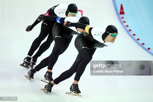 Mathieu Giroux, Denny Morrison and Lucas Makowsky of Canada compete during the Men's Team Pursuit Final B Speed Skating event on day fifteen of the...