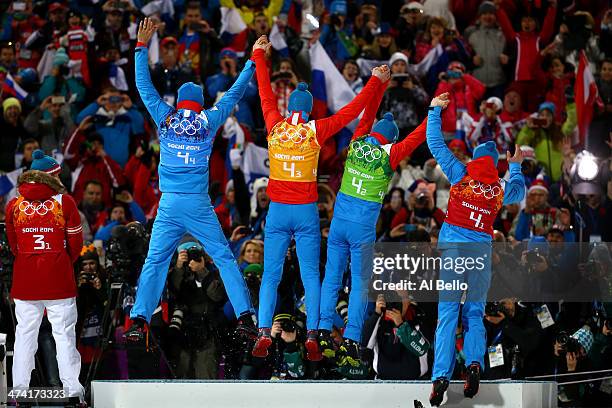 Gold medalists Anton Shipulin, Dmitry Malyshko, Evgeny Ustyugov and Alexey Volkov of Russia celebrate on the podium during the medal ceremony for the...