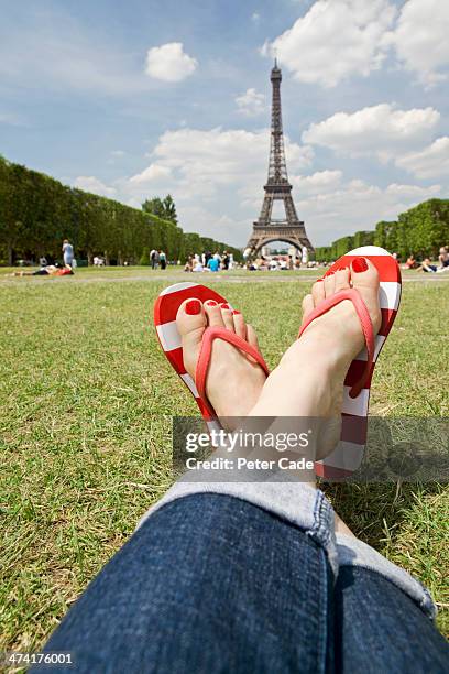 woman's legs with eiffel tower in background - red flip flops isolated stock pictures, royalty-free photos & images
