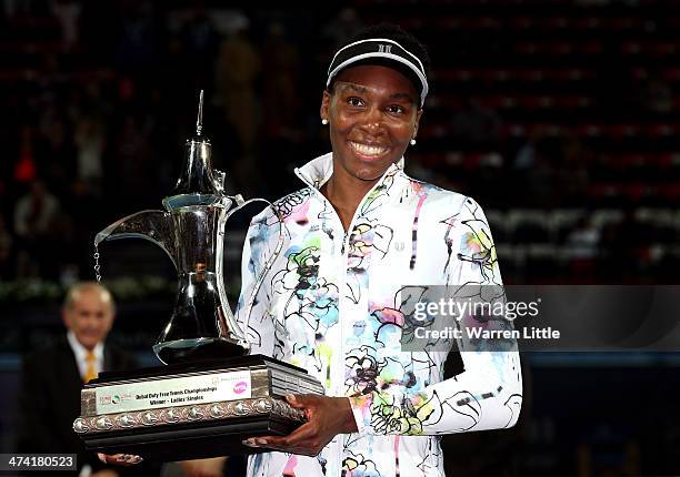 Venus Williams of the USA poses with the trophy after beating Alize Cornet of France in the final of the WTA Dubai Dury Free Tennis Championship at...