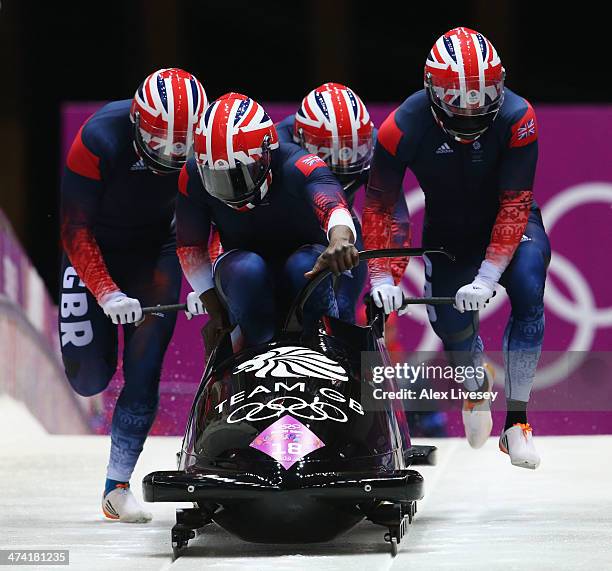 Pilot Lamin Deen, John Baines, Andrew Matthews and Ben Simons of Great Britain team 2 make a run during the Men's Four Man Bobsleigh heats on Day 15...