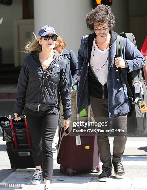 Renee Zellweger and Doyle Bramhall are seen at LAX on May 20, 2015 in Los Angeles, California.