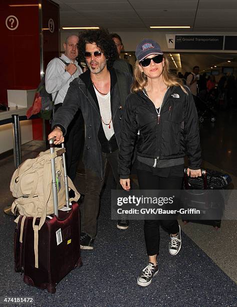 Renee Zellweger and Doyle Bramhall are seen at LAX on May 20, 2015 in Los Angeles, California.