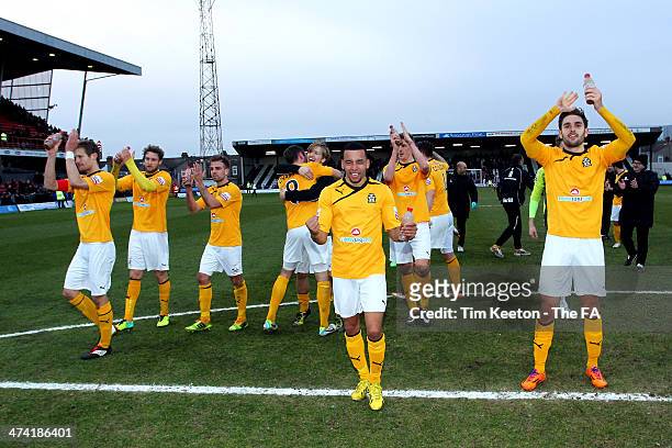 Cambridge players celebrate after the final whistle during the FA Trophy Semi Final Second Leg match between Grimsby Town and Cambridge United at...