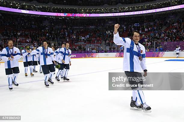 Bronze medalists Teemu Selanne of Finland and teammates celebrate after defeating the United States 5-0 during the Men's Ice Hockey Bronze Medal Game...