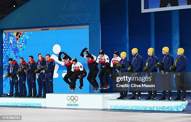 Silver medalists Great Britain, gold medalists Canada and bronze medalists Sweden celebrate during the medal ceremony for Men's Curling on Day 15 of...