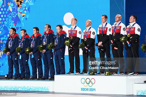 Silver medalists Great Britain and gold medalists Canada celebrate during the medal ceremony for Men's Curling on Day 15 of the Sochi 2014 Winter...