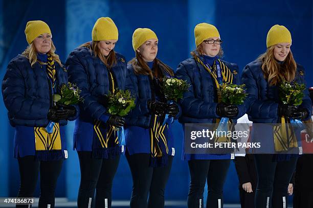 Swedish silver medalists Agnes Knochenhauer, Maria Wennerstrom, Christina Bertrup, Maria Prytz and Margaretha Sigfridsson pose during the Women's...
