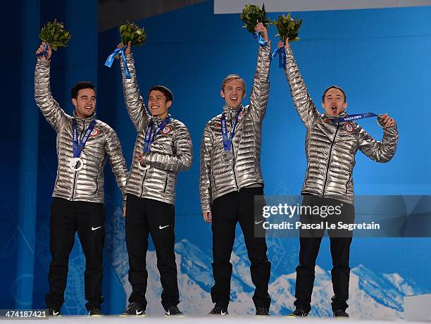 Silver medalists Eduardo Alvarez, JR Celski, Christopher Creveling and Jordan Malone of the United States celebrate on the podium during the medal...