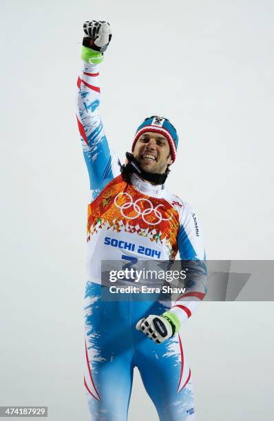 Mario Matt of Austria celebrates on the podium after winning gold during the medal ceremony for the Men's Slalom during day 15 of the Sochi 2014...