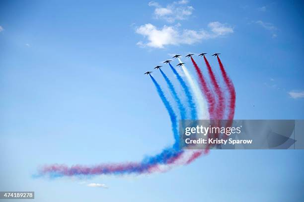 General view of the aerial display and fly past by the Patrouille de France in the gardens of the historic Chateau de Versailles on May 20, 2015 in...