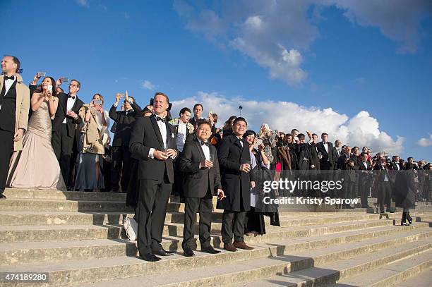 Guests watch an incredible aerial display and fly past by the Patrouille de France in the gardens of the historic Chateau de Versailles on May 20,...