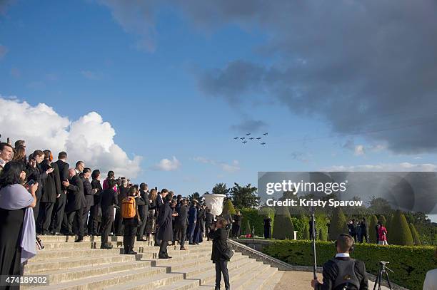 Guests watch an incredible aerial display and fly past by the Patrouille de France in the gardens of the historic Chateau de Versailles on May 20,...