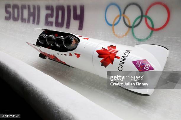 Pilot Lyndon Rush, Lascelles Brown, David Bissett and Neville Wright of Canada team 2 make a run during the Men's Four Man Bobsleigh heats on Day 15...