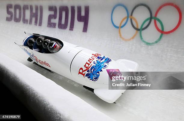 Pilot Alexander Zubkov, Alexey Negodaylo, Dmitry Trunenkov and Alexey Voevoda of Russia team 1 make a run during the Men's Four Man Bobsleigh heats...