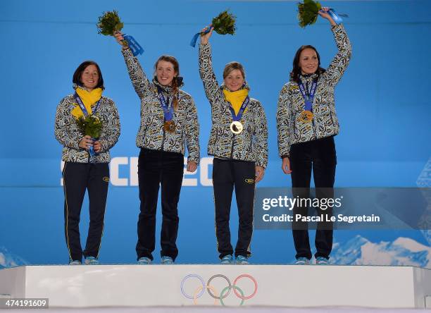Gold medalists Vita Semerenko, Juliya Dzhyma, Valj Semerenko and Olena Pidhrushna of Ukraine celebrate during the medal ceremony for the Biathlon...