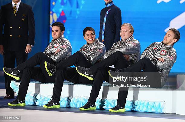 Silver medalists Eduardo Alvarez, JR Celski, Christopher Creveling and Jordan Malone of the United States celebrate on the podium during the medal...