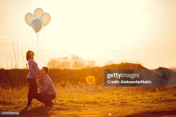 the tree of us - balloon stomach stockfoto's en -beelden