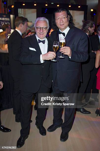 Alain Ducasseen and guest enjoys a Martell cocktail at the the Martell cocktail at the Martell 300th anniversary eventheld at the Chateau de...