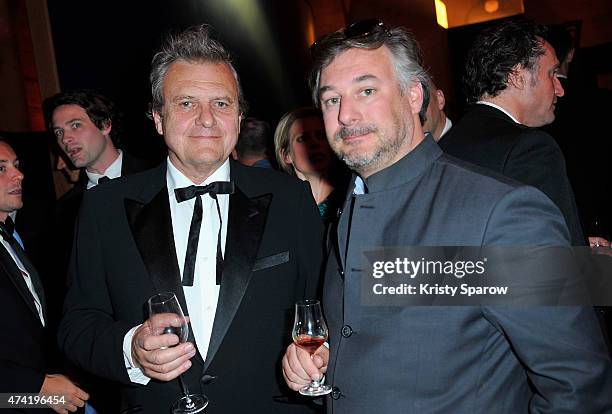 Jean-Charles de Castelbajac and guest enjoy a Martell cocktail at the Martell 300th anniversary eventheld at the Chateau de Versailles on May 20,...