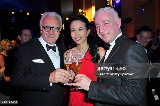 Alain Ducasse, Karen Mok and Thierry Hernandez enjoy a Martell cocktail at the the Martell cocktail at the Martell 300th anniversary eventheld at the...
