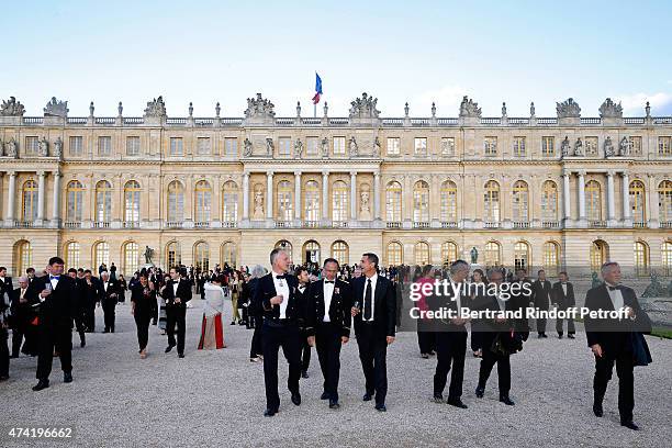 Guests watch an incredible aerial display and fly past by the Patrouille de France in the gardens of the historic Palace of Versailles, ahead of...