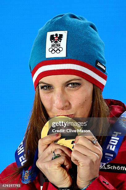 Gold medalist Julia Dujmovits of Austria celebrates during the medal ceremony for the Snowboard Ladies' Parallel Slalom on Day 15 of the Sochi 2014...