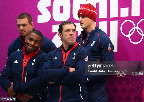 Pilot John James Jackson, Stuart Benson, Bruce Tasker and Joel Fearon of Great Britain team 1 look on after a run during the Men's Four Man Bobsleigh...