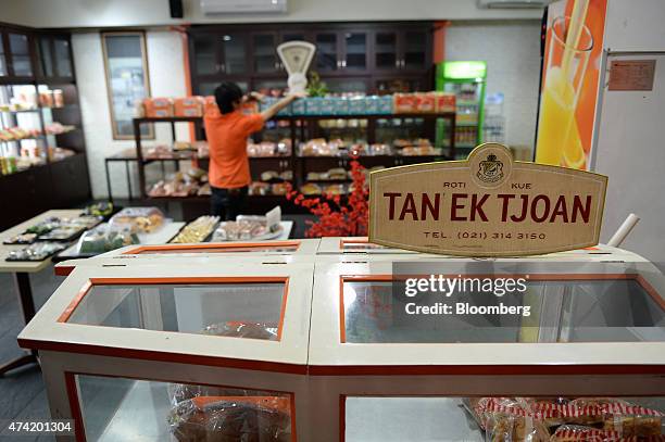 Signage for the Tan Ek Tjoan bakery is displayed at a bread store in Jakarta, Indonesia, on Wednesday, May 20, 2015. A voracious appetite for...