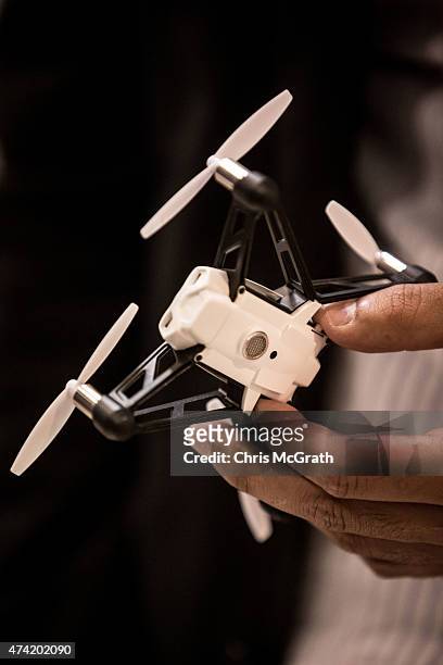 Man handles a mini drone on display at the International Drone Expo 2015 at Makuhari Messe on May 21, 2015 in Chiba, Japan.