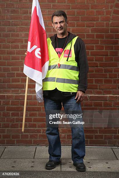 Henry Yusuf an employee of Deutsche Post and who has joined a strike organized by the ver.di labor union, poses for a photo on May 19, 2015 in...