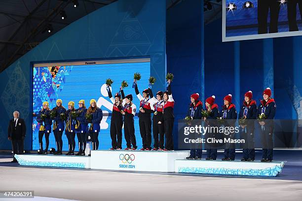 Silver medalists Sweden, gold medalists Canada and bronze medalists Great Britain celebrate during the medal ceremony for Women's Curling on Day 15...