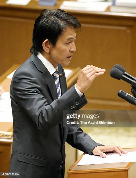 Japan Innovation Party leader Yorihisa Matsuno asks questions during the one-on-one debate with Japanese Prime Minister Shinzo Abe at the diet...