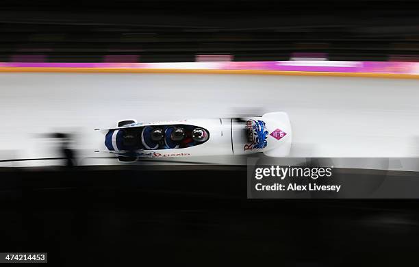 Pilot Alexander Zubkov, Alexey Negodaylo, Dmitry Trunenkov and Alexey Voevoda of Russia team 1 make a run during the Men's Four Man Bobsleigh heats...